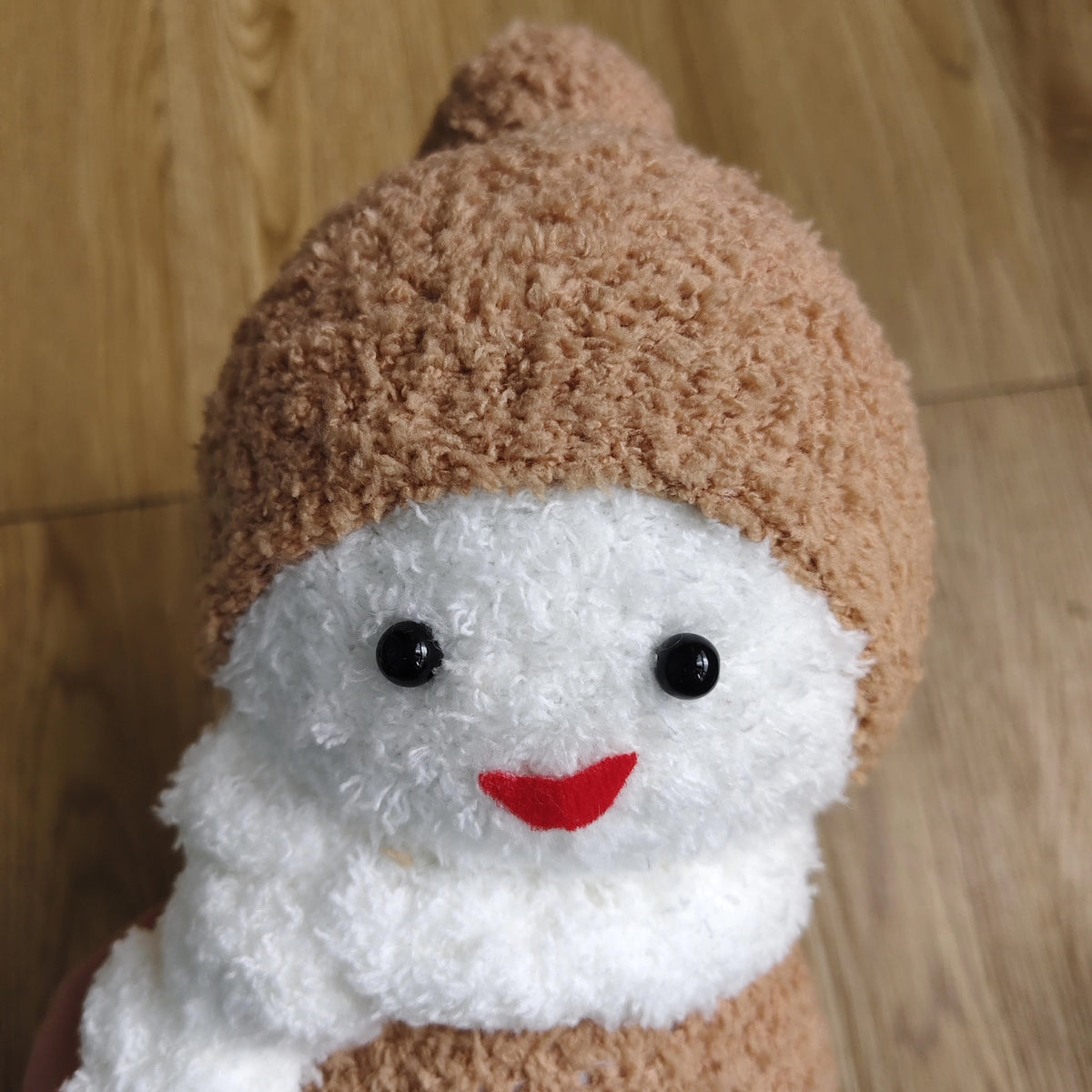 Pupazzo di neve in peluche e calza artigianale