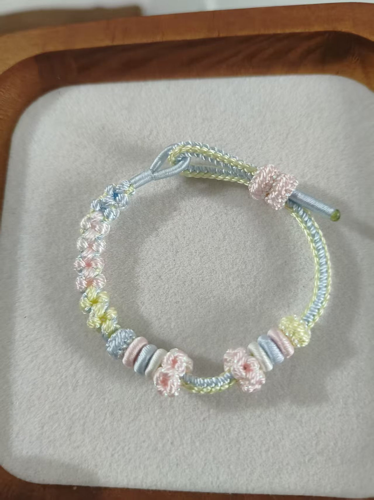 Handwoven Gradient Bracelet with Floral Decor