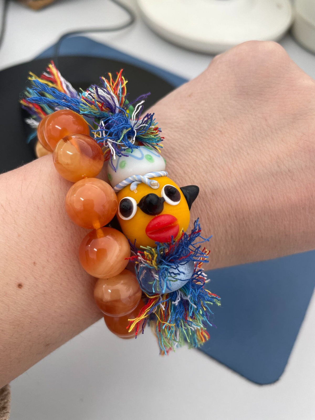 Handcrafted Glass Bead Bracelet With Yellow Doll Head
