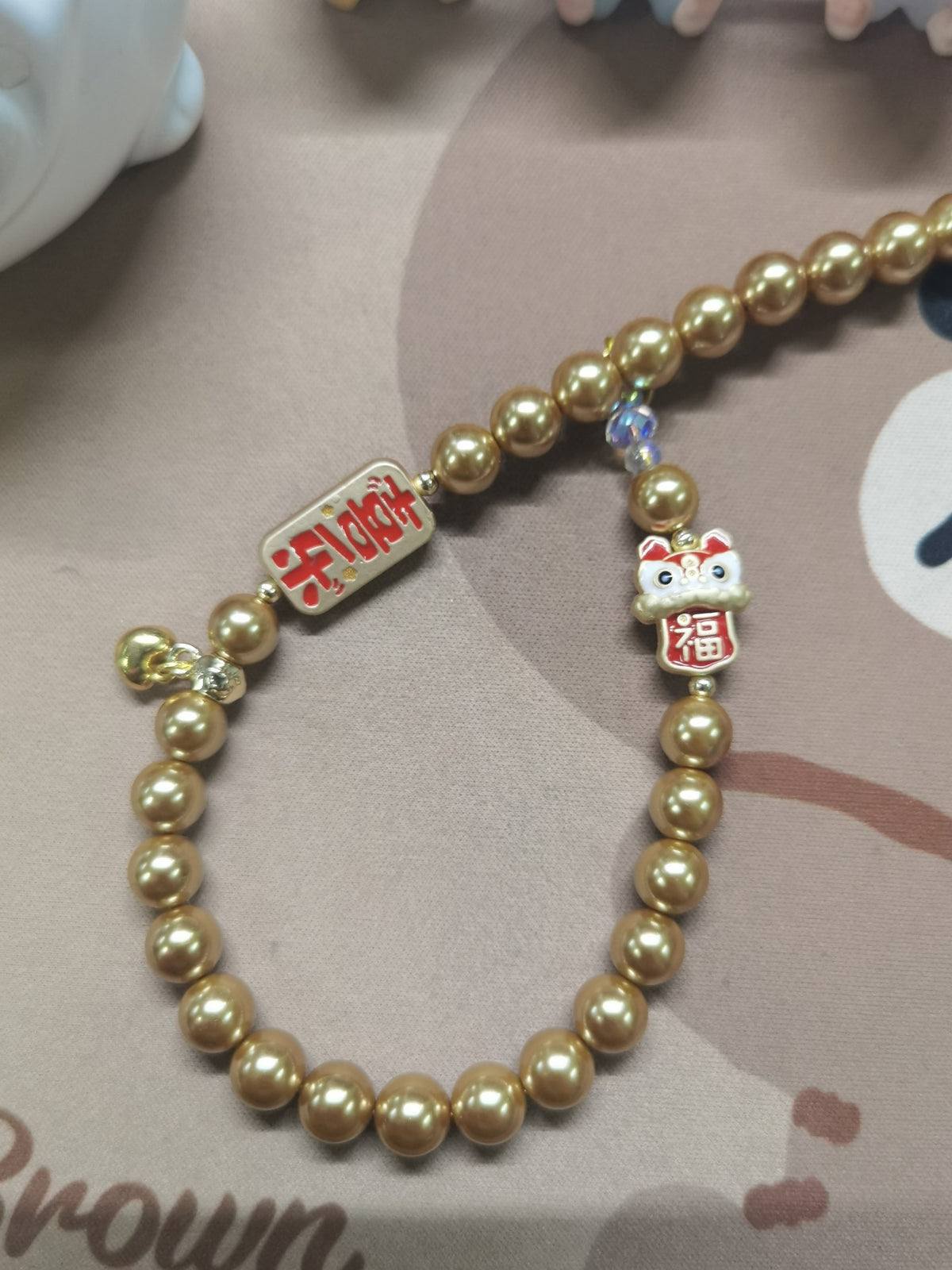 Champagne Pearl Lion Phone Charm