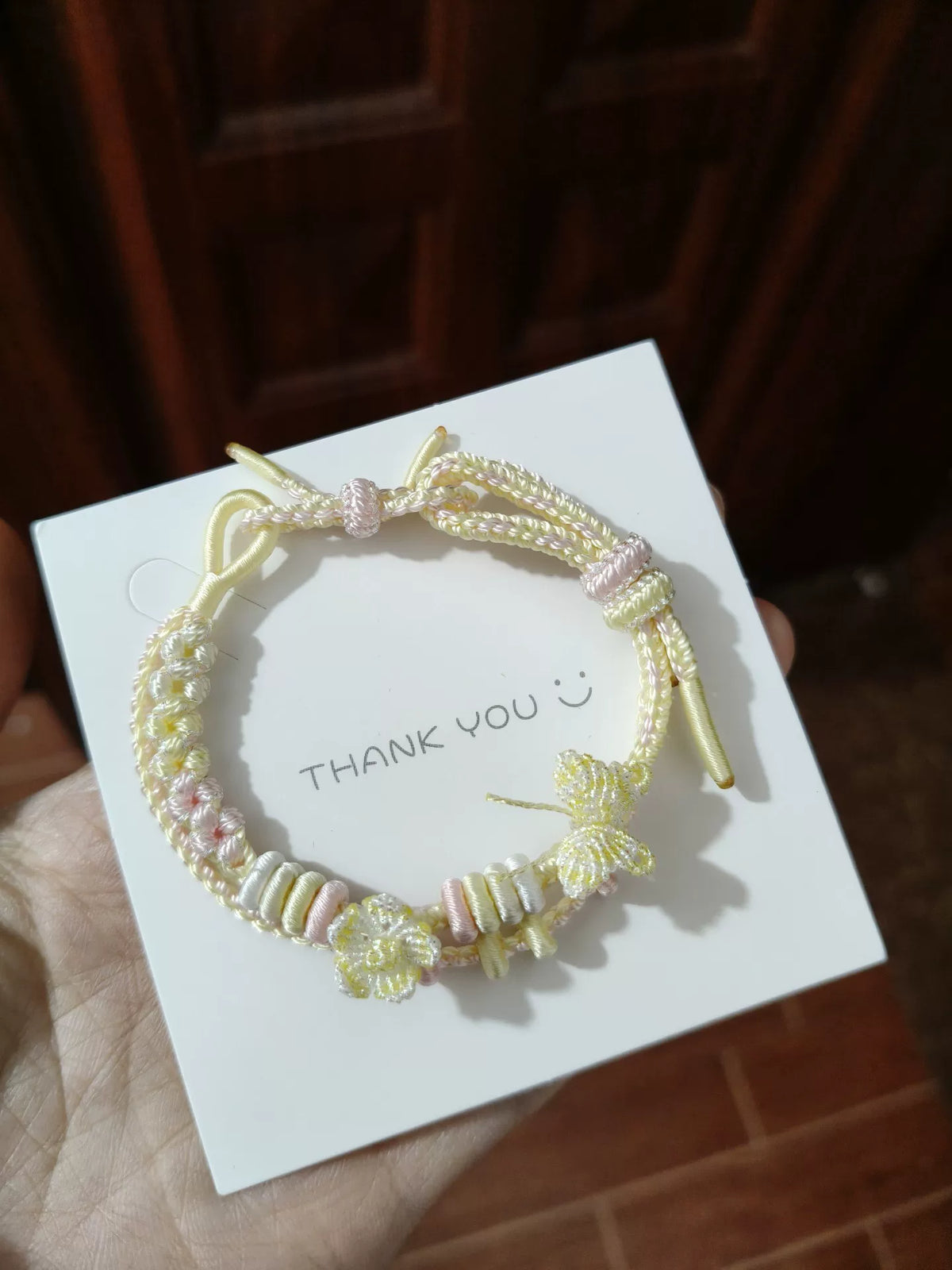 Bracelet en cordon tressé fait main dégradé crème et rose