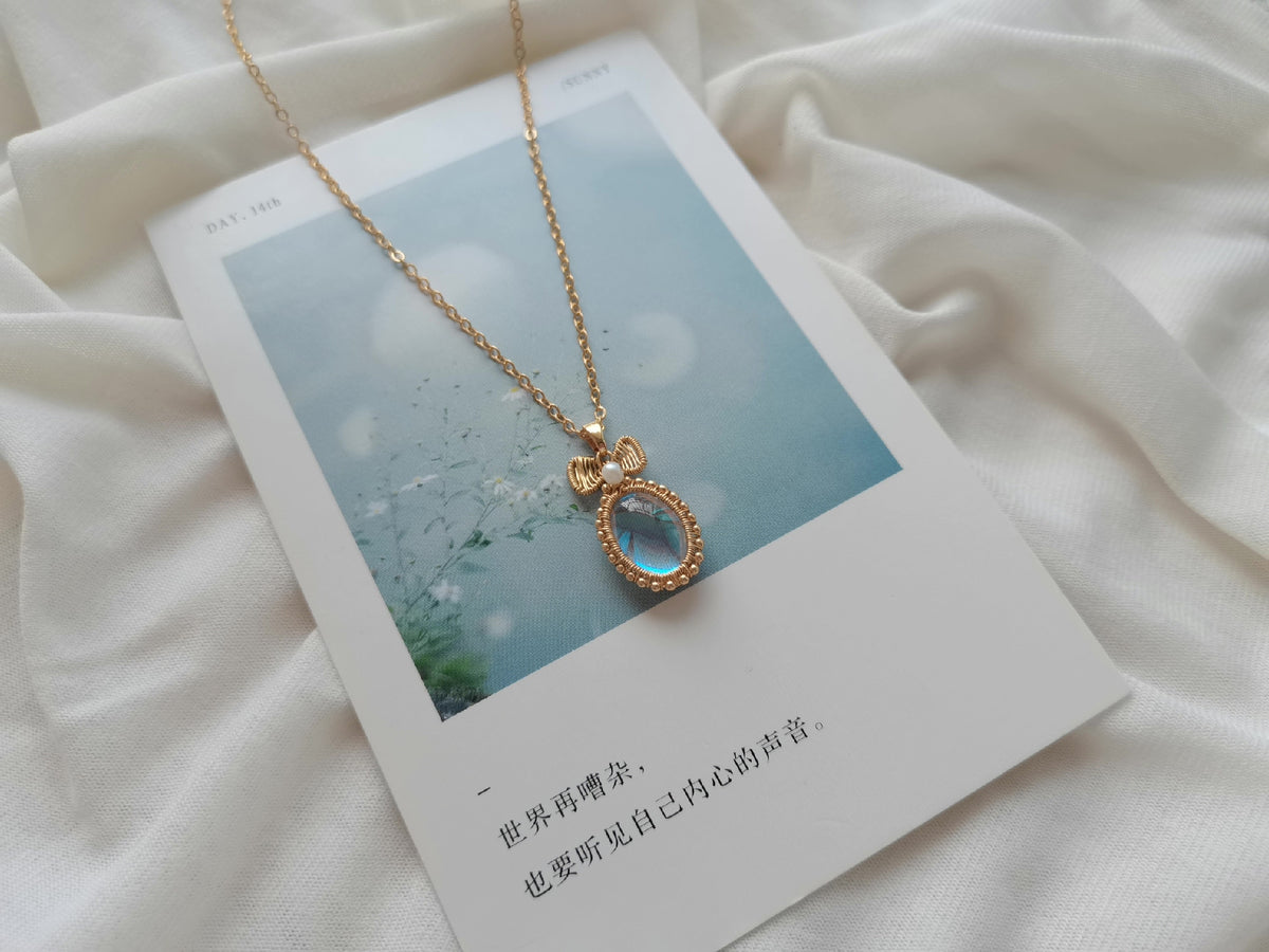 Blue Moonlight Glass Bow Pendant Necklace