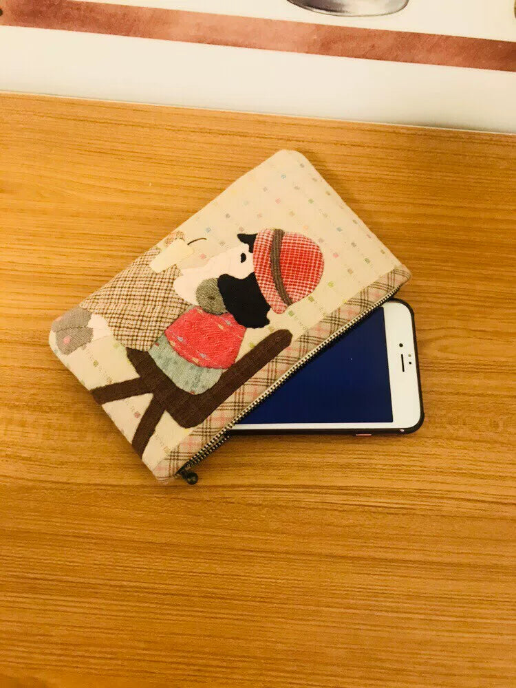 Estuche con cremallera de tejido teñido de hilo hecho a mano