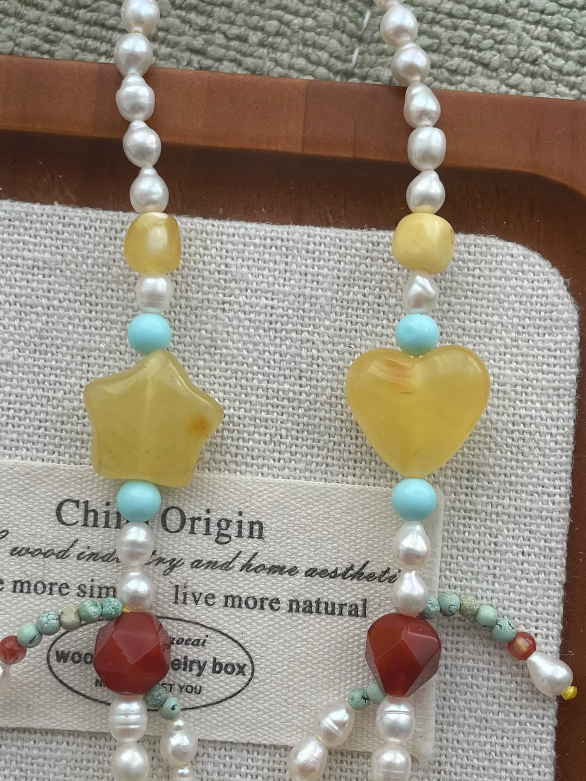 Collier double rang ours en ambre, perles et turquoise