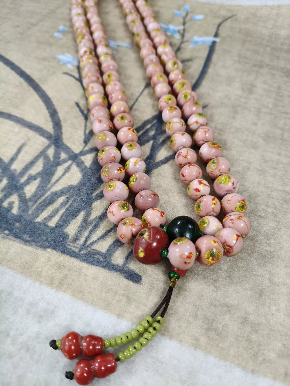 Collar de 108 Contas Rosa com Olho de Fénix