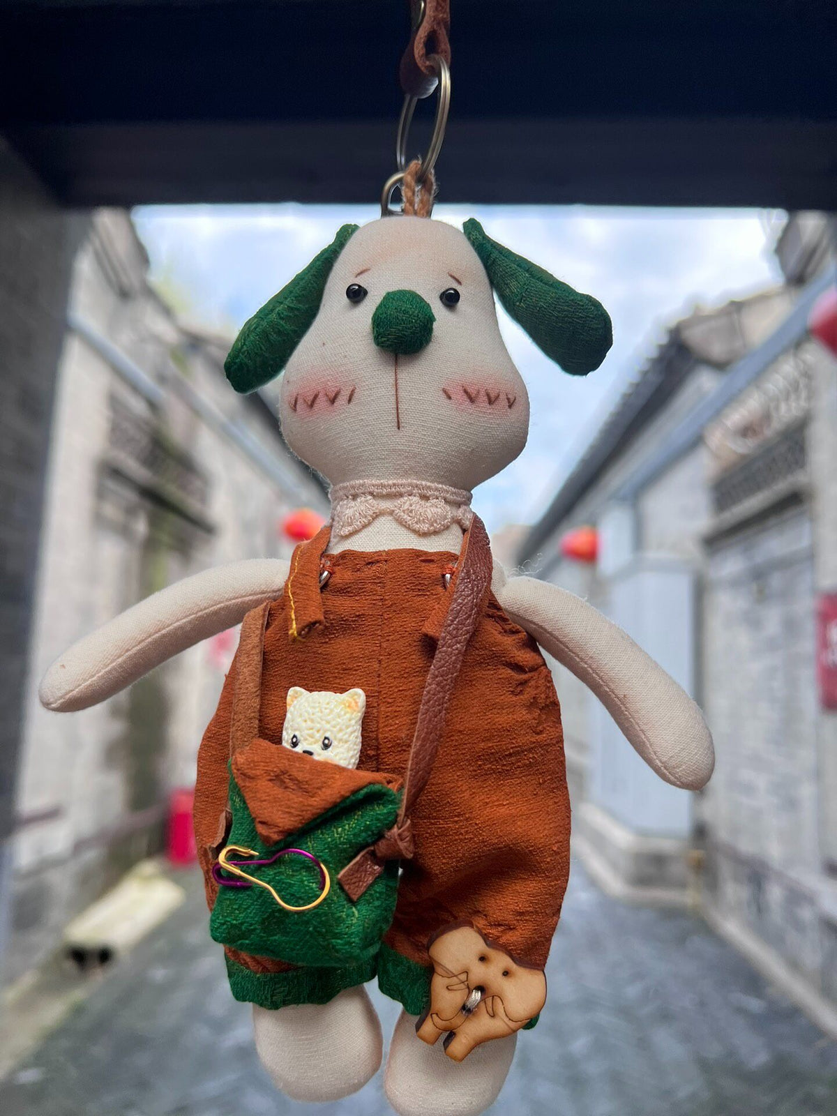 Plush Dog Pendant Keychain with Green Pouch