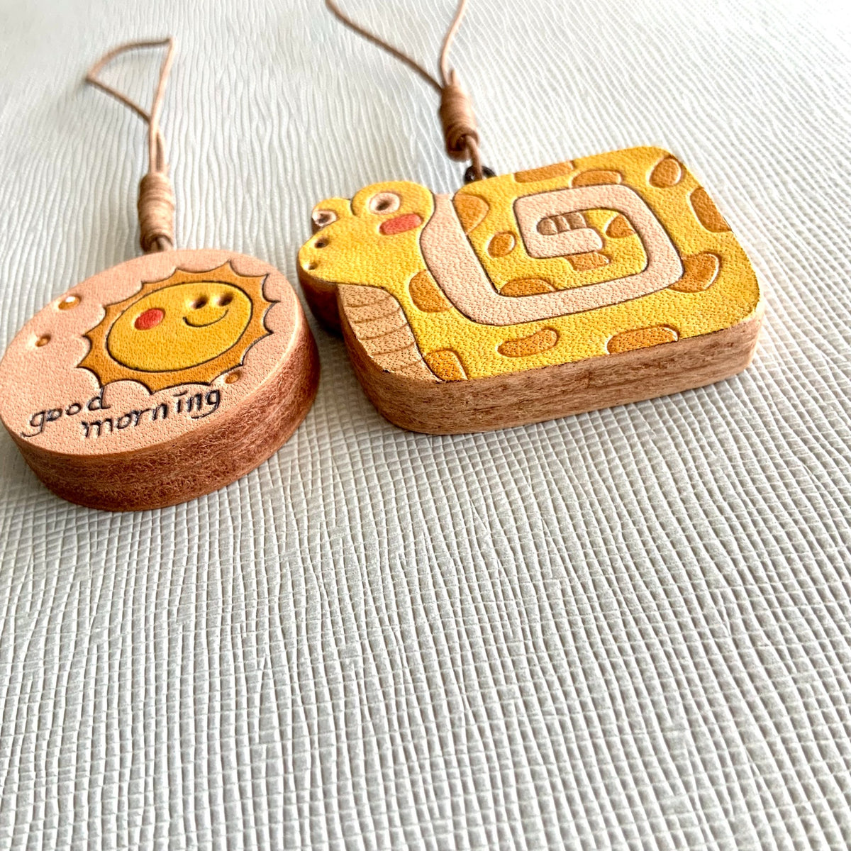 Leren Slang en Zon Charm Set