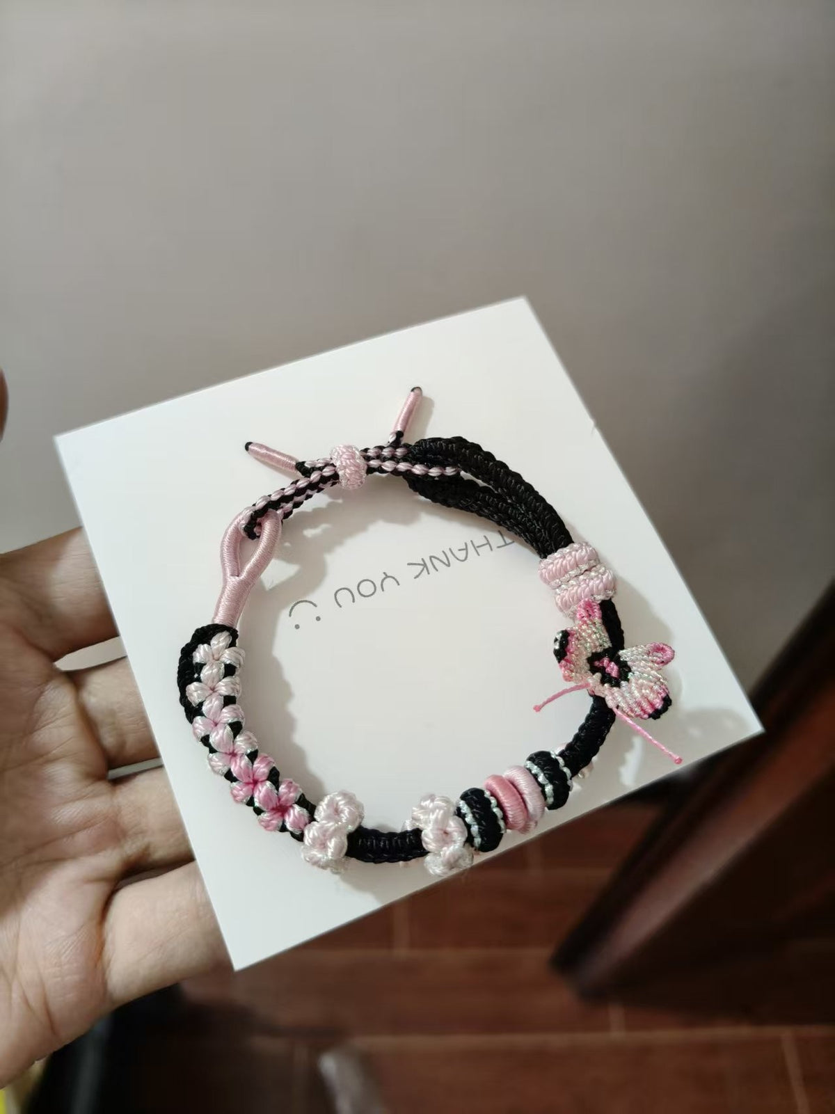 Handwoven Black Pink Gradient Bracelet with Butterfly Charm