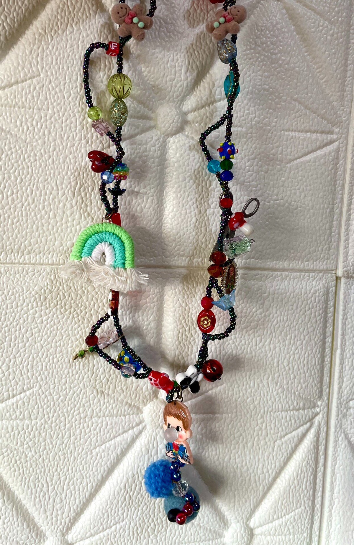 Multistrand Beaded Necklace with Figurine Pendant