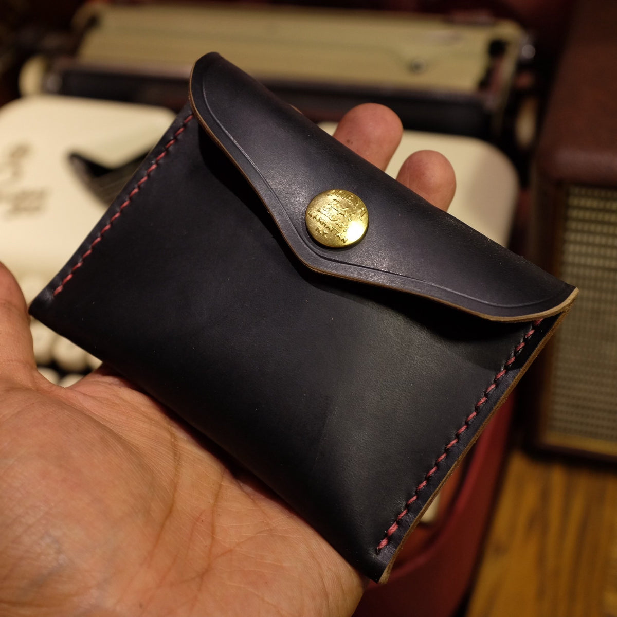 Black Horween Leather Bifold Wallet with Brass Snap Closure