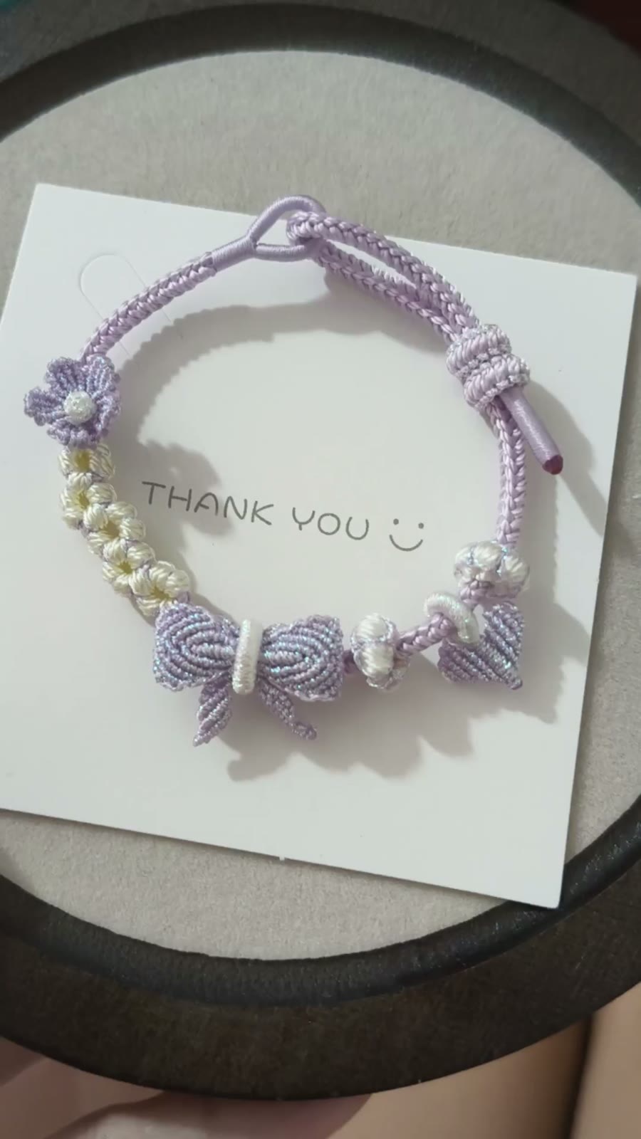 Braccialiale in cordino con sfumatura viola e bianco