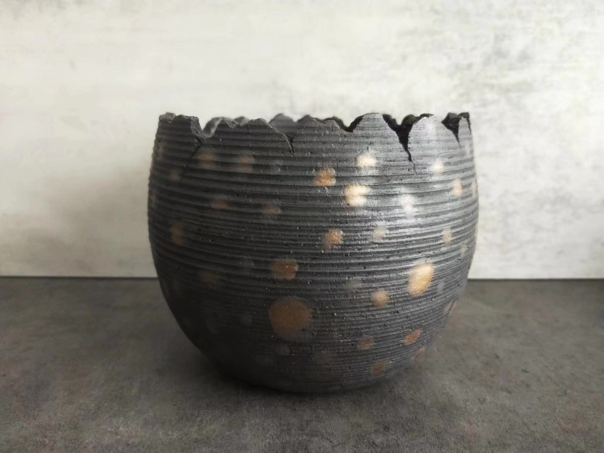Handcrafted Ceramic Vessel with Serrated Rim