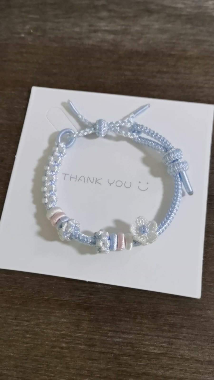 Handwoven Blue Gradient Bracelet with Flower Charm