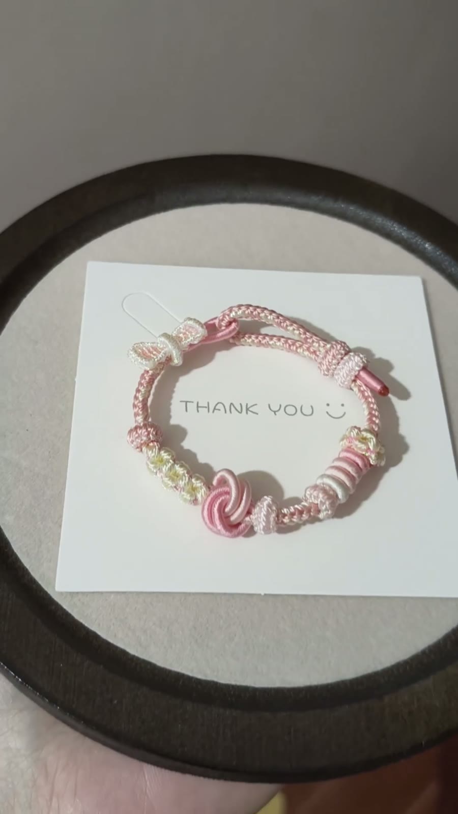 Braccialiale in cordino intrecciato a mano sfumatura rosa bianco