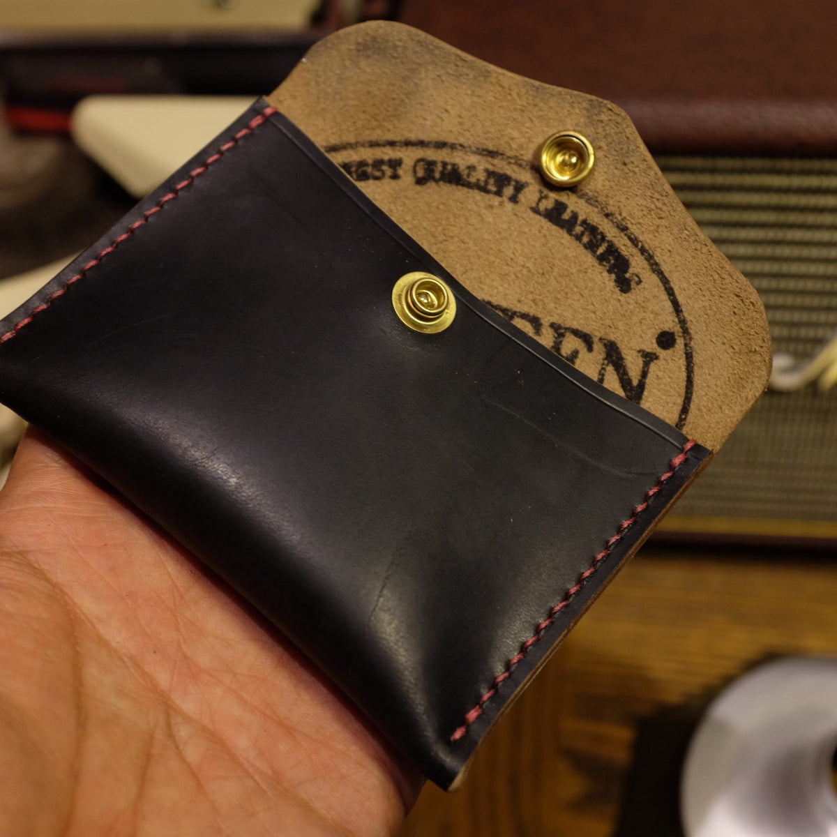 Black Horween Leather Bifold Wallet with Brass Snap Closure