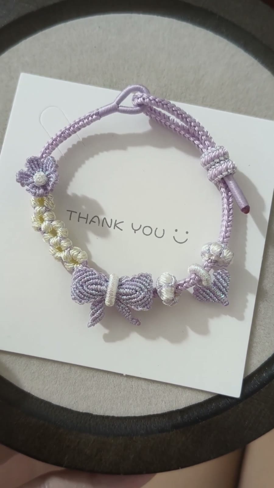 Braccialiale in cordino con sfumatura viola e bianco