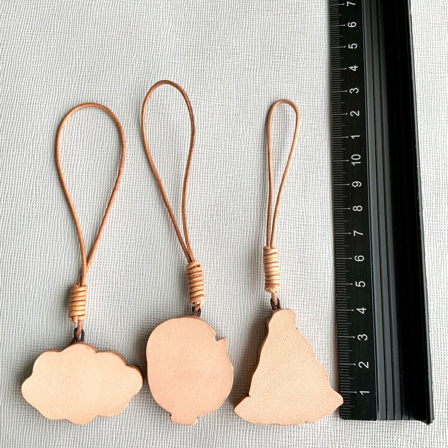 Handcrafted Leather Charm Set with Cartoon Motifs