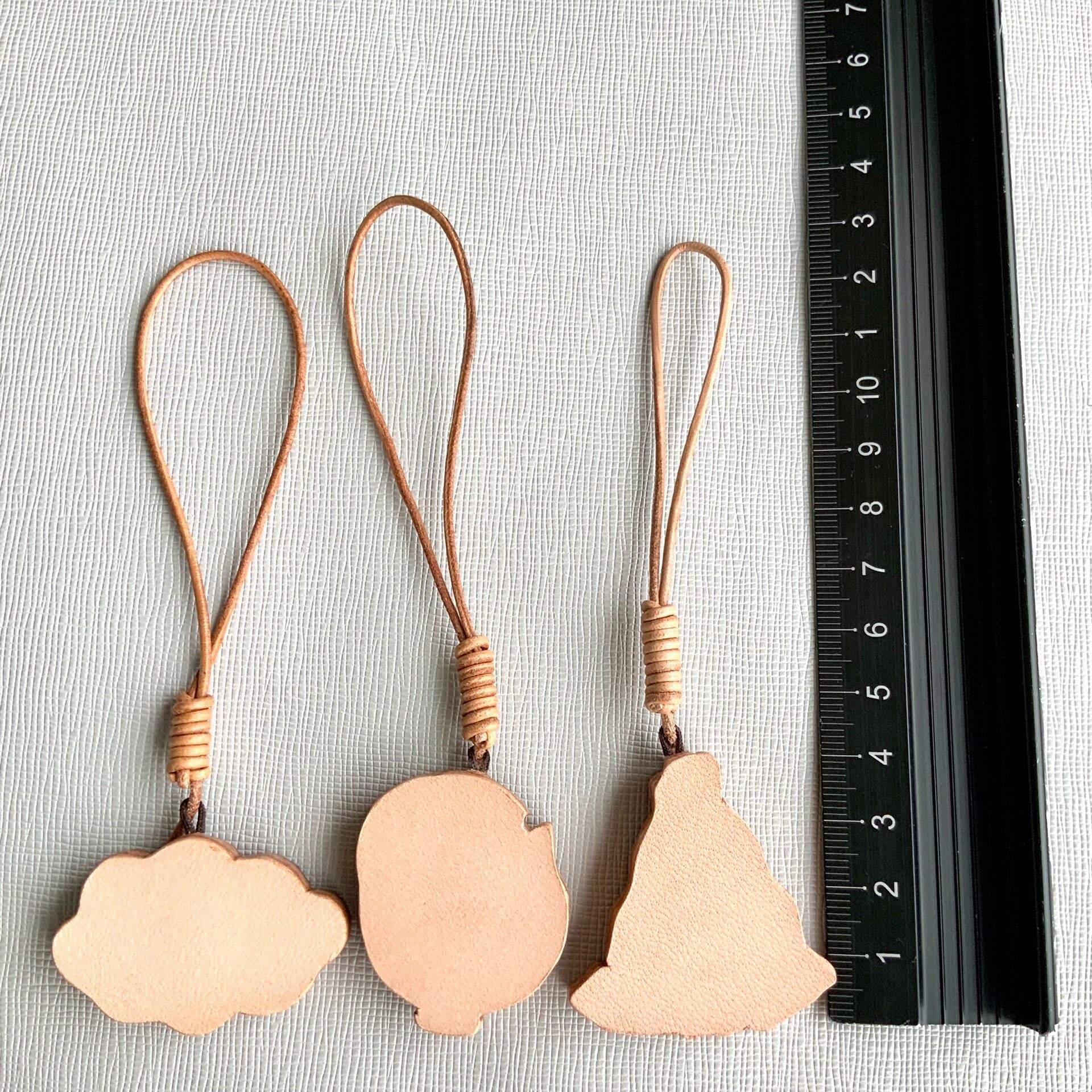 Handcrafted Leather Charm Set with Cartoon Motifs