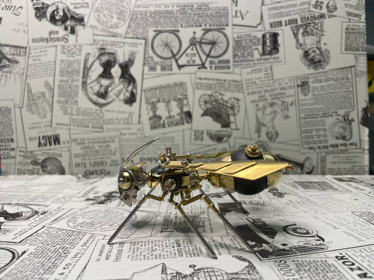 Mekanisk geting i steampunkmodell i mässing och metall