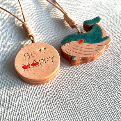 Handcrafted Leather Pendants: "BE HAPPY" Disc and Whale Charm