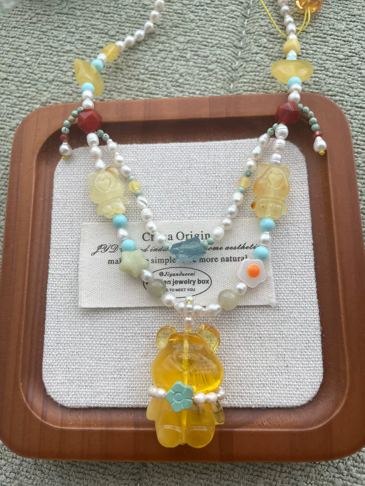 Collier double rang ours en ambre, perles et turquoise