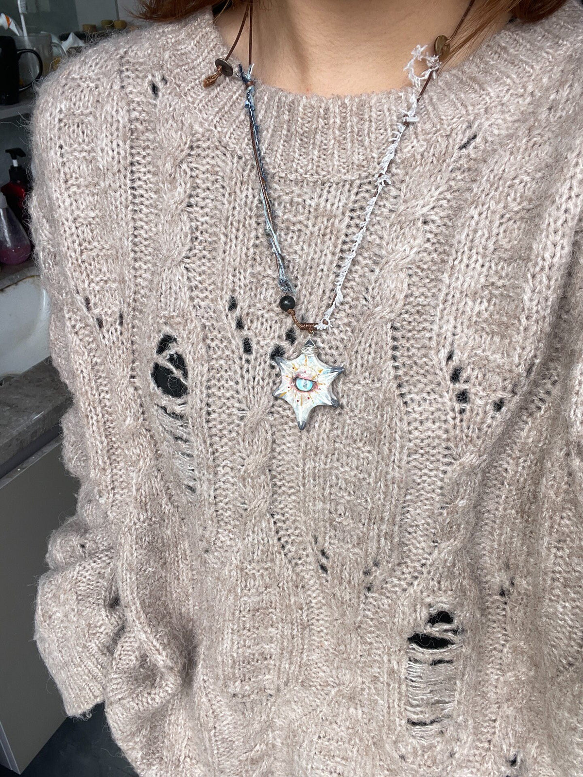 Collar artesanal de arcilla con estrella y piedra de ágata
