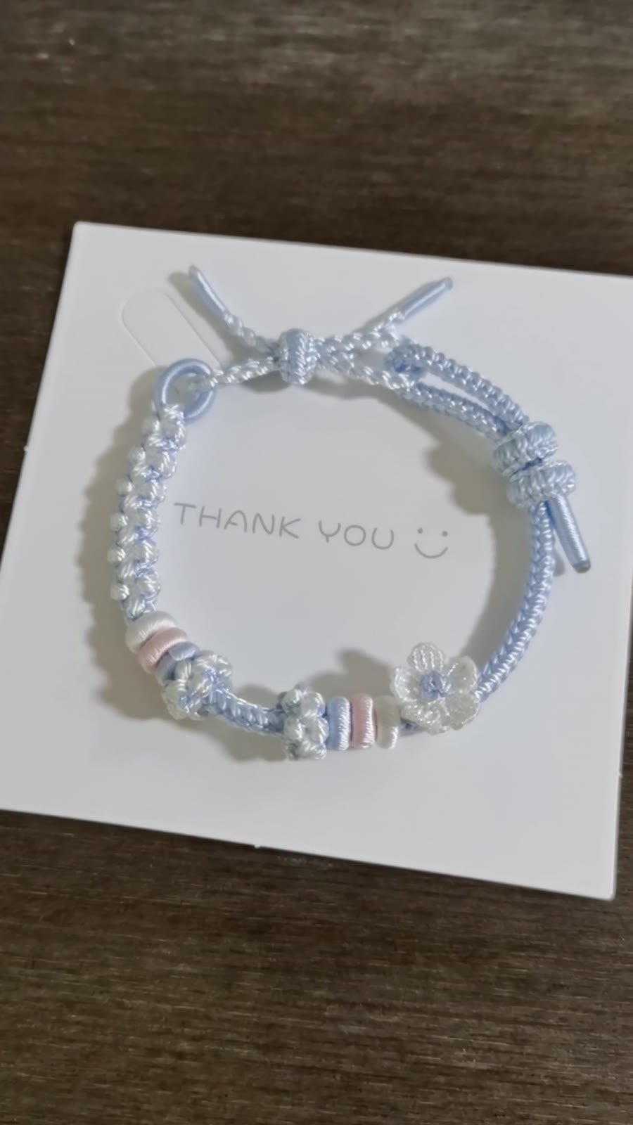 Handwoven Blue Gradient Bracelet with Flower Charm