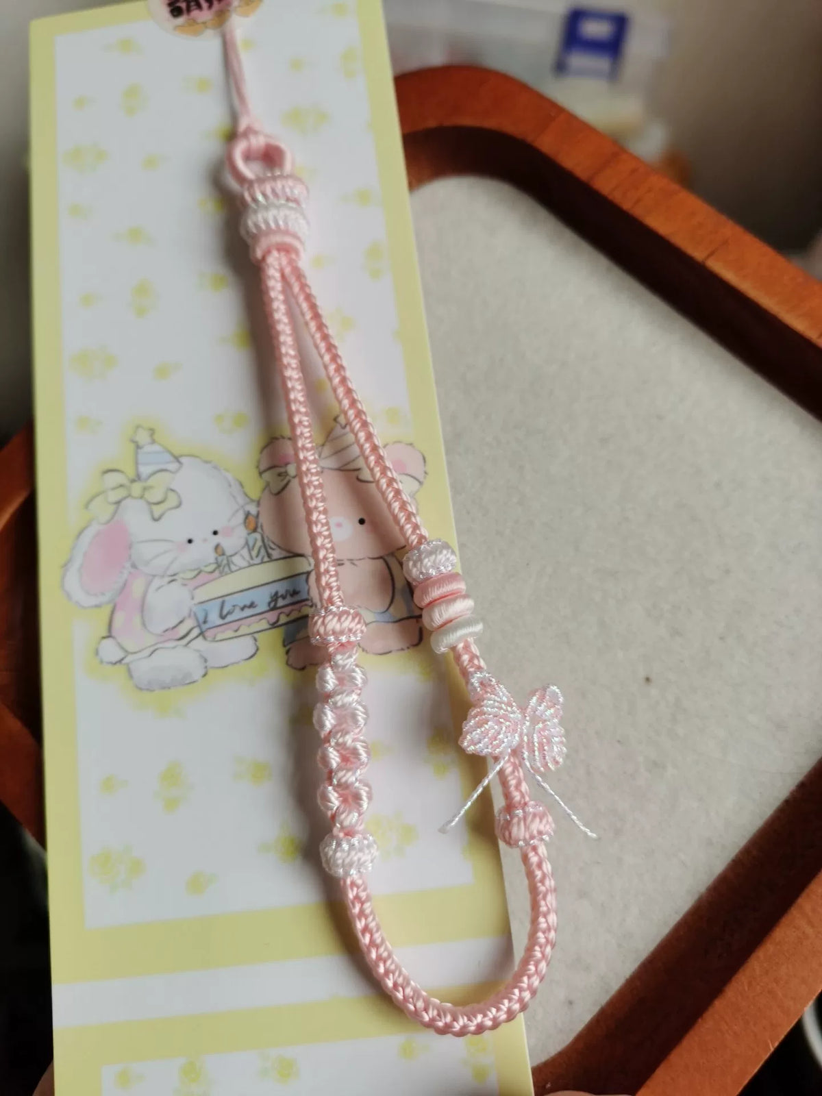 ハンドメイド編み込みスマホストラップ ブルー×ピンク グラデーション