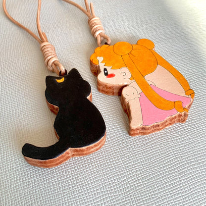 Two Thick Leather Keychain Pendants: Black Cat and Blonde Girl