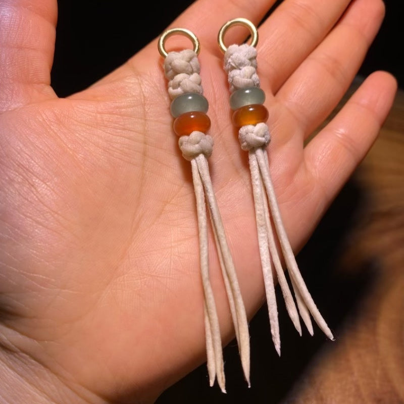 Handcrafted Tibetan Tassel with White Leather Cord and Green and Amber Beads