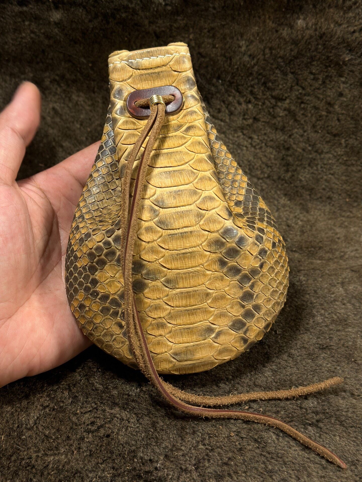 Artisanal Leather Pouch with Dragon Scale Texture and Adjustable Opening