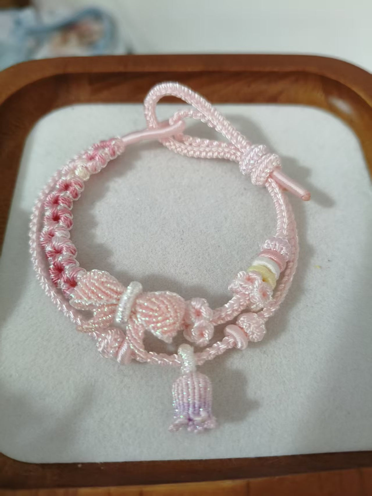 Handwoven Pink Gradient Bracelet with Floral Decor
