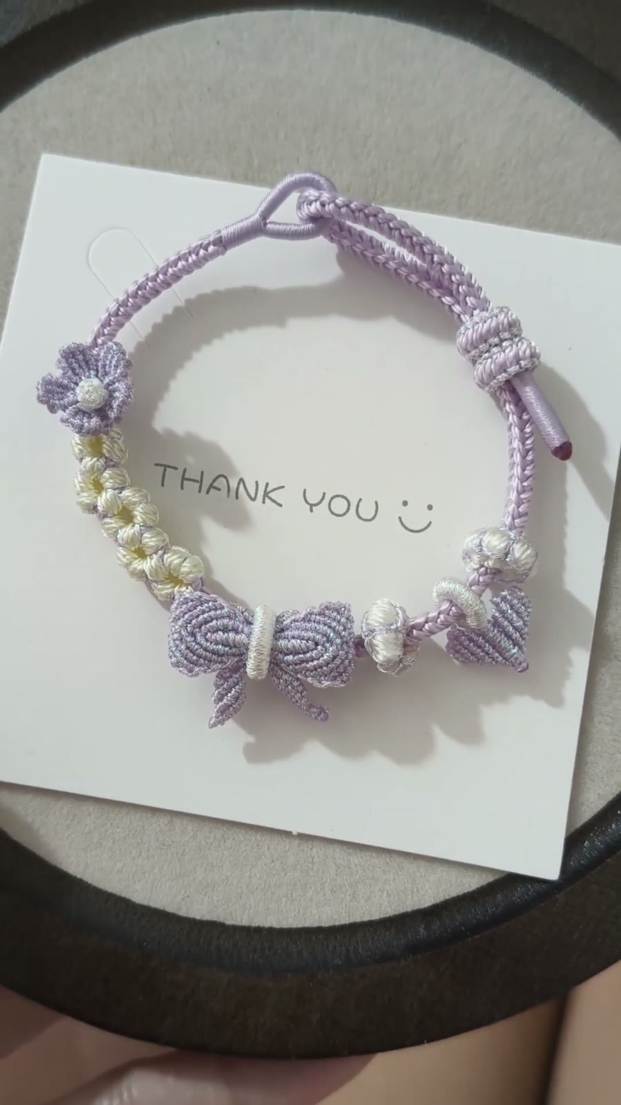 Braccialiale in cordino con sfumatura viola e bianco
