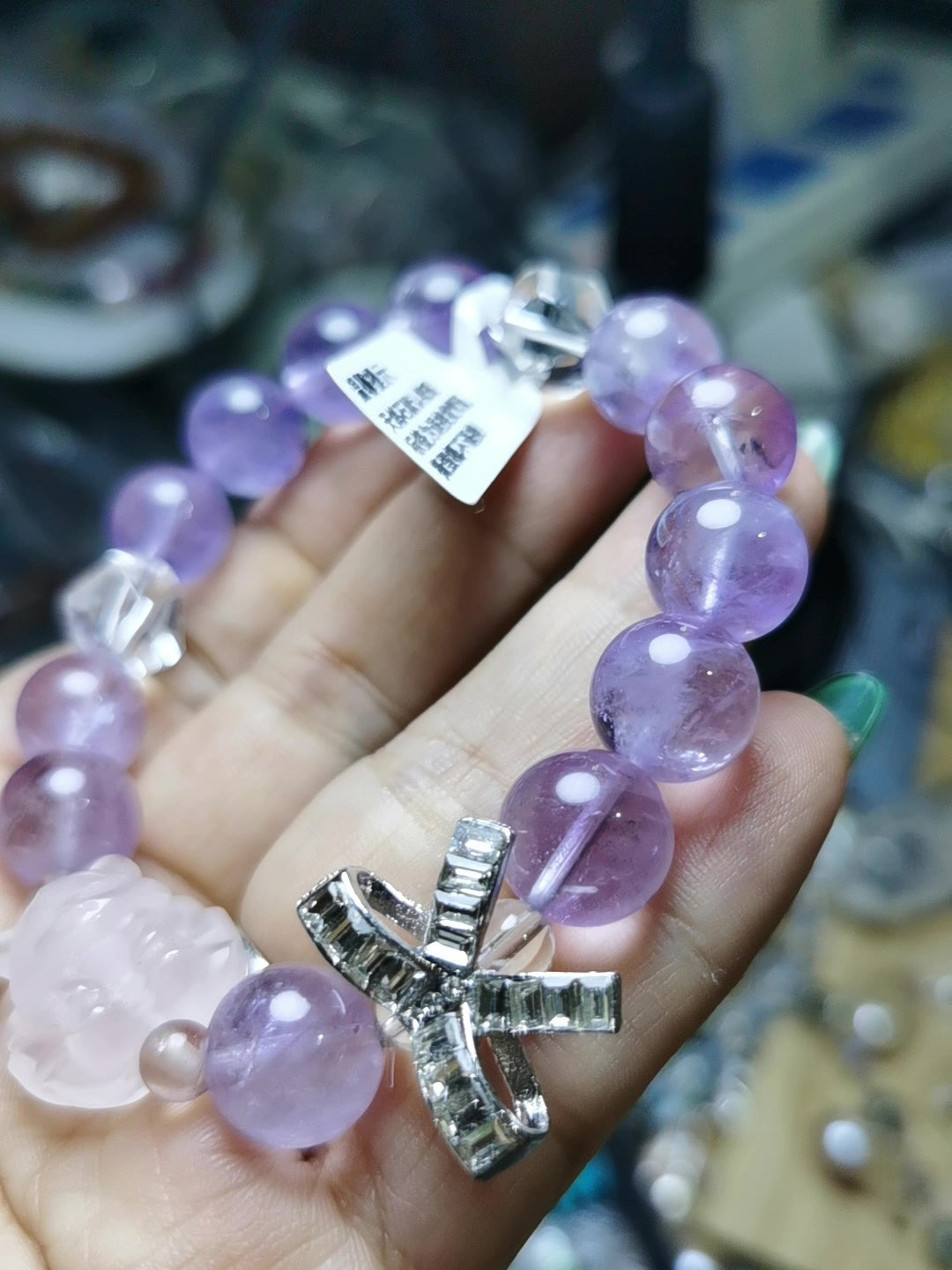 Armband i lila ametist med rosa rävshäng