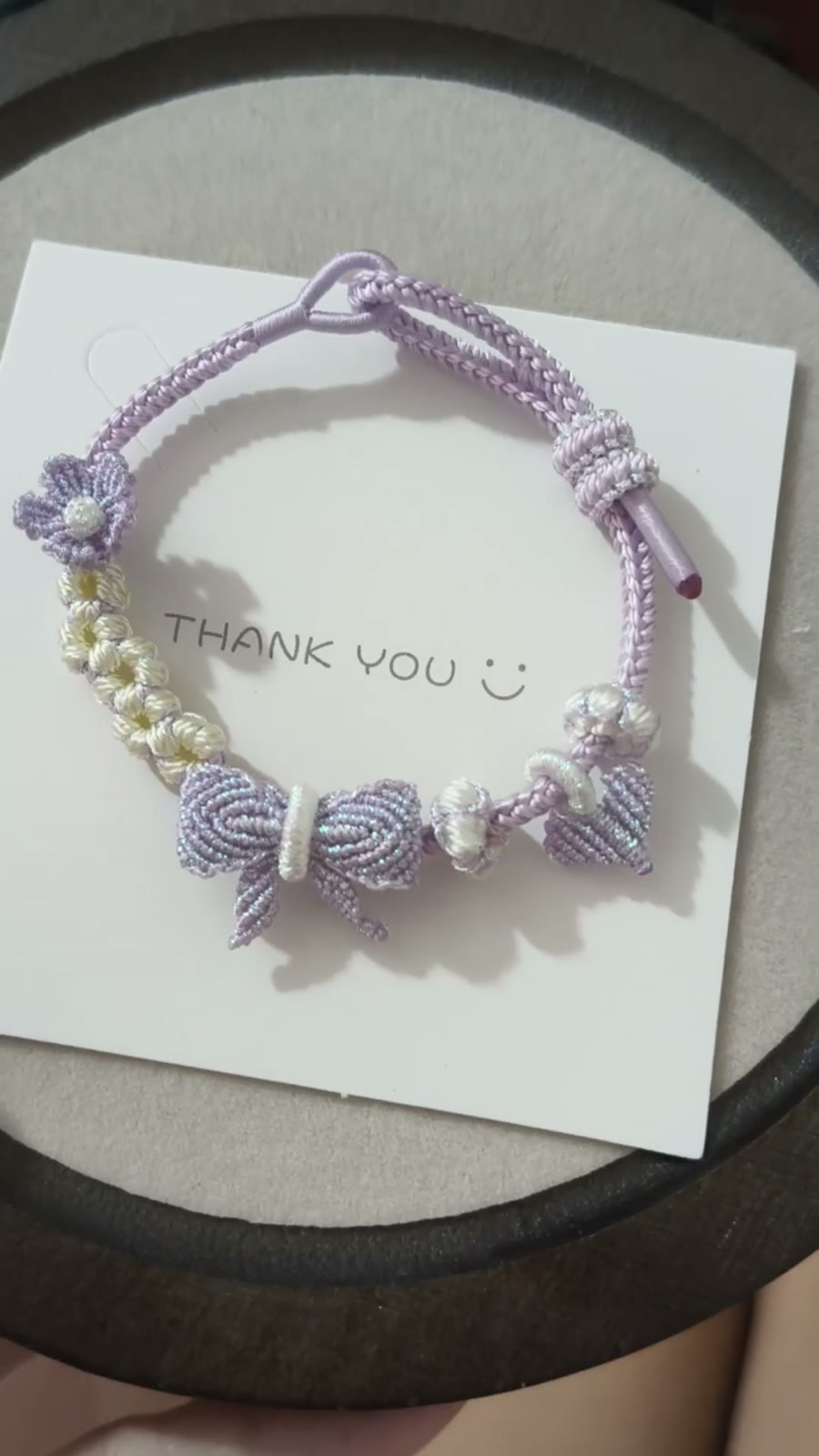 Braccialiale in cordino con sfumatura viola e bianco