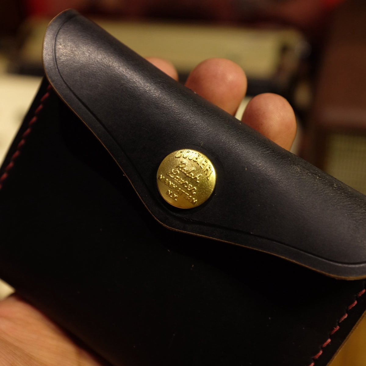 Black Horween Leather Bifold Wallet with Brass Snap Closure