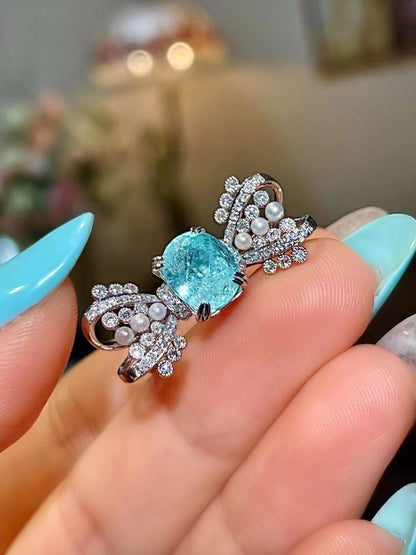 18k Gold Ring with Cushion-Cut Neon Blue Gem, Diamond and Pearl Bow-Tie Wings