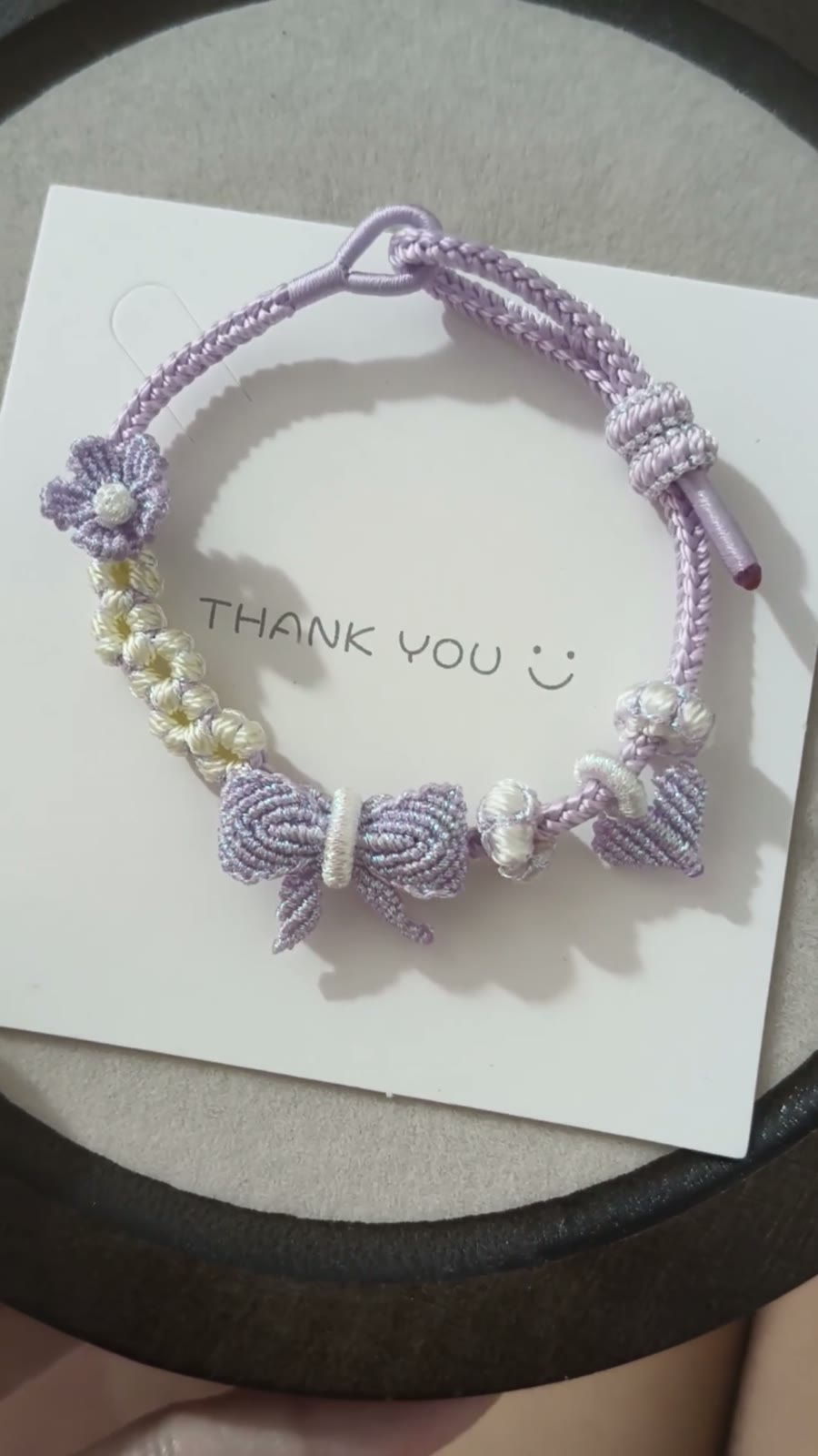 Braccialiale in cordino con sfumatura viola e bianco