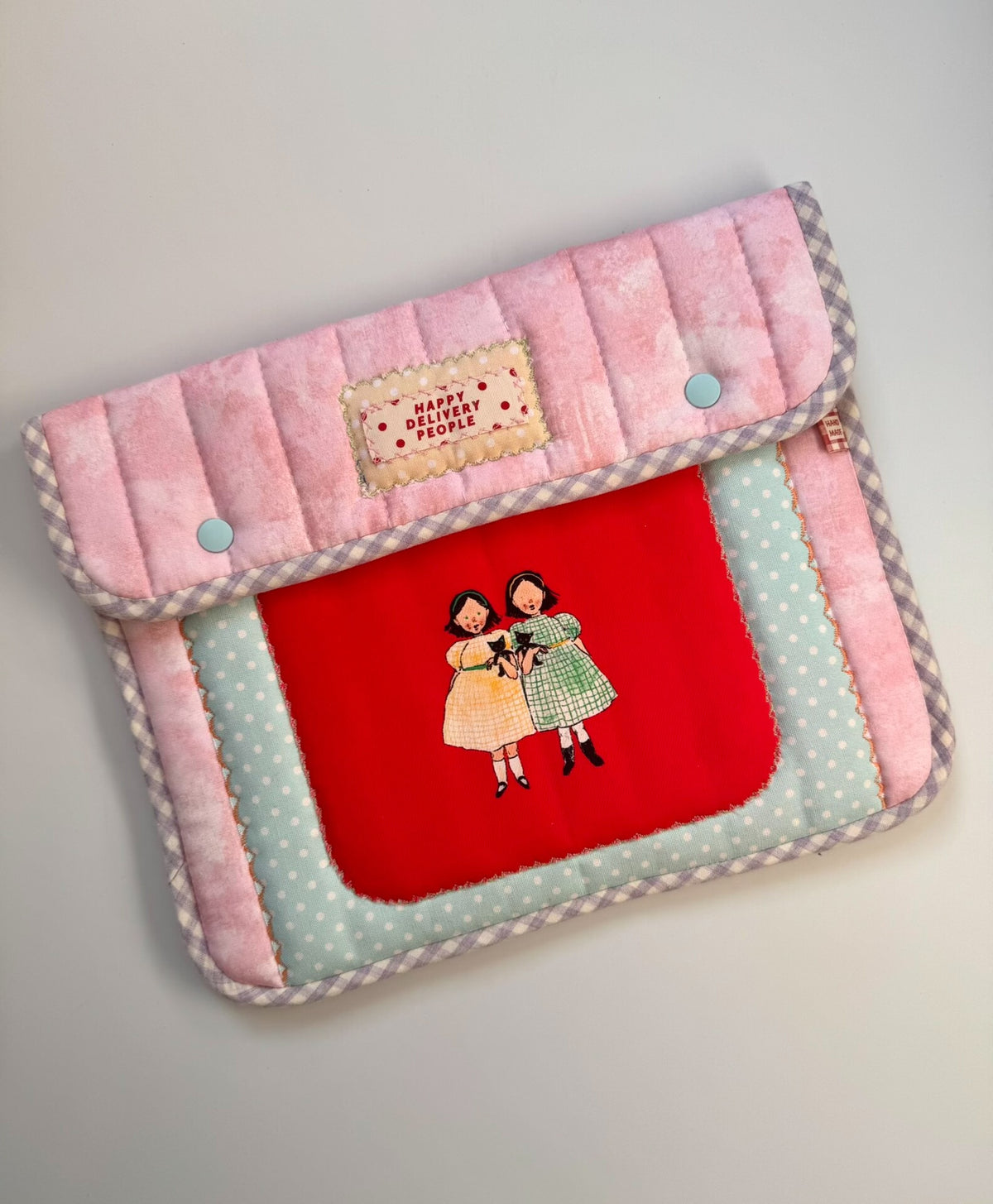 Funda de tela acolchada en rosa