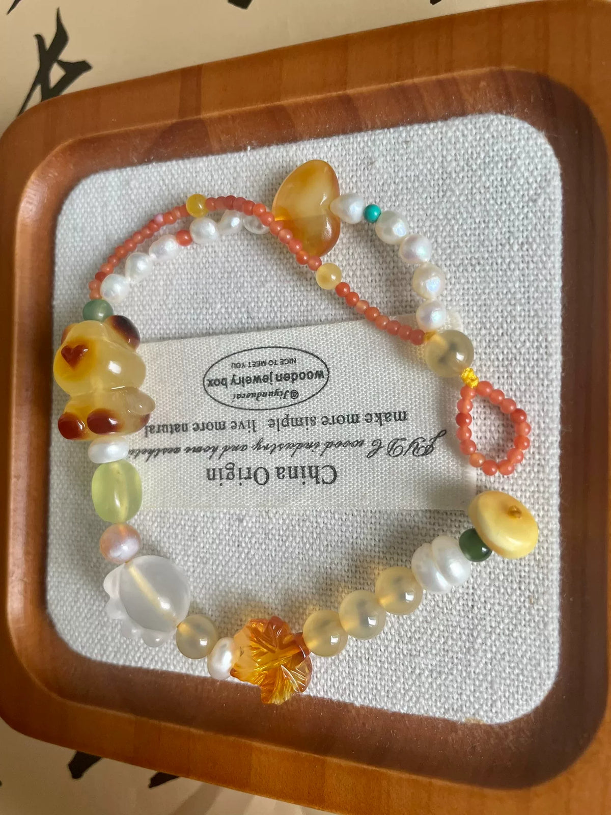 Natürlicher Bienenwachsbernstein-Bären-Perlenarmband