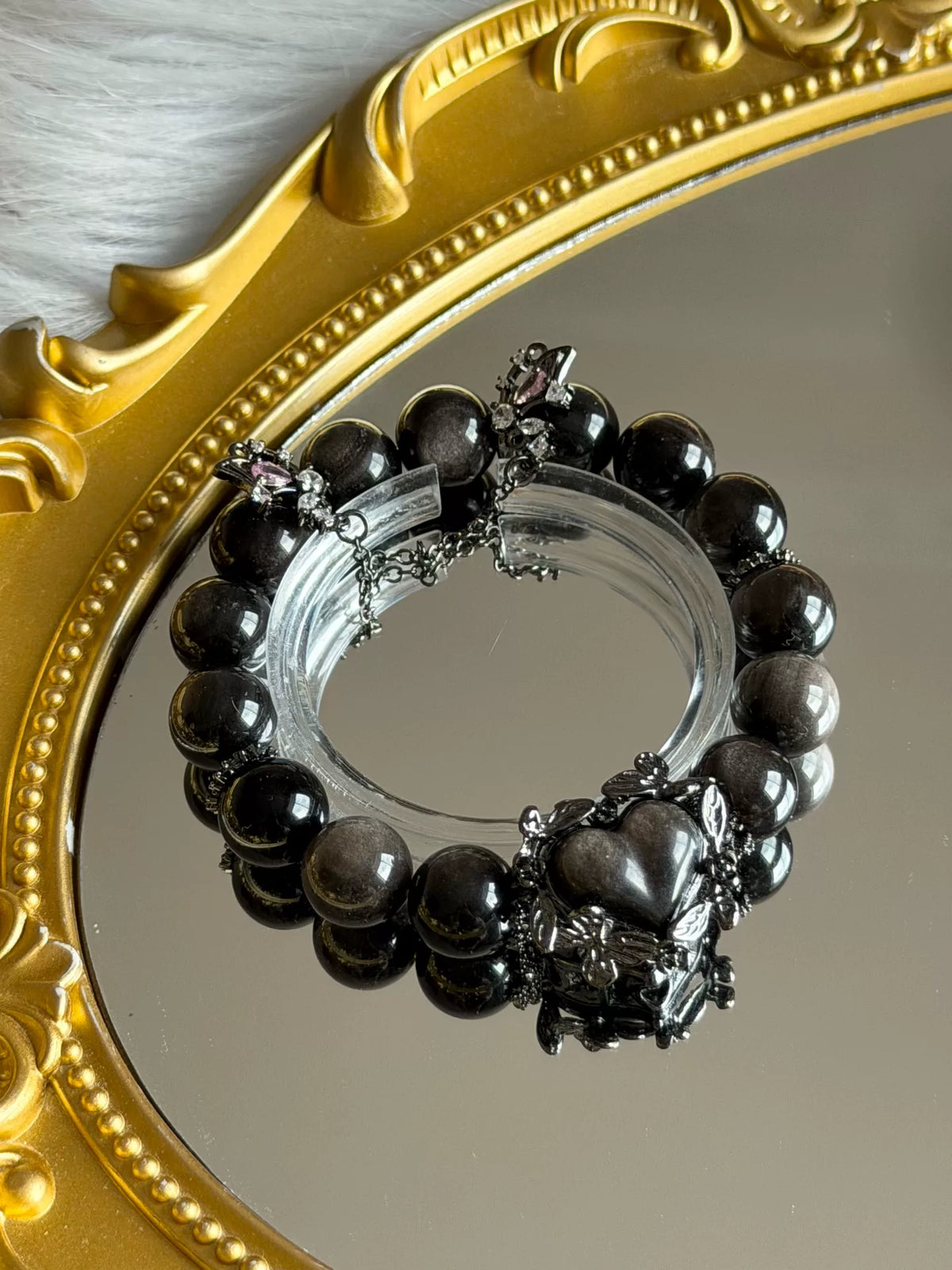Armband van natuurlijke obsidiaan met zilverachtige glans 12mm