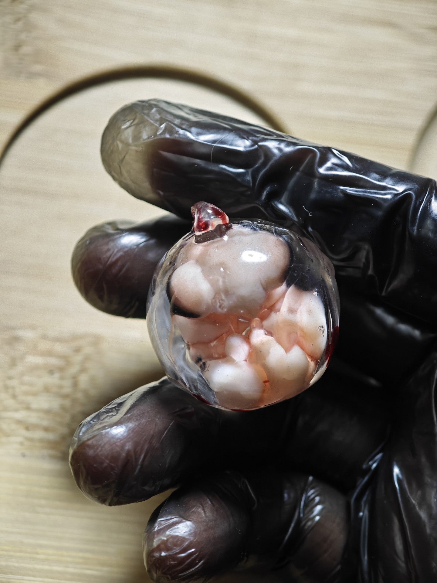 Resin Spherical Pendant with Embryonic Figure