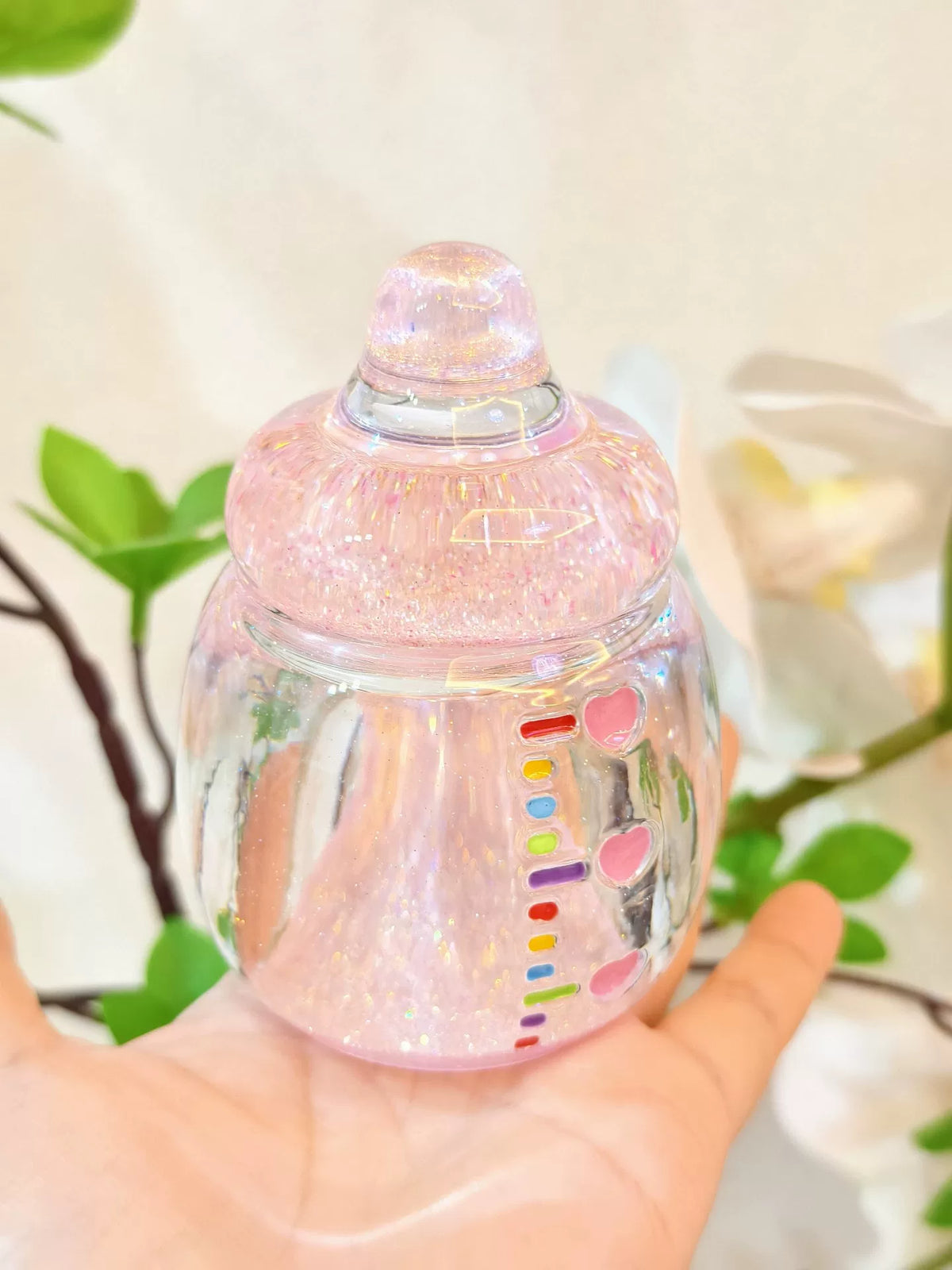 Glittriga rosa resin-nappflaskor twistburkar