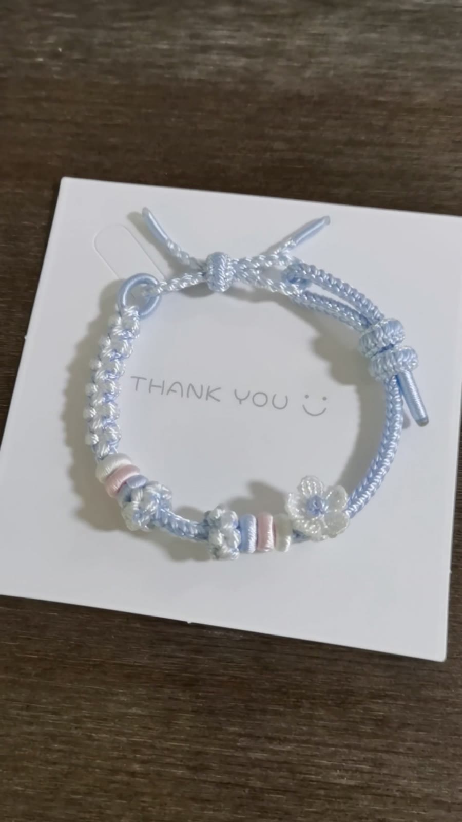 Handwoven Blue Gradient Bracelet with Flower Charm