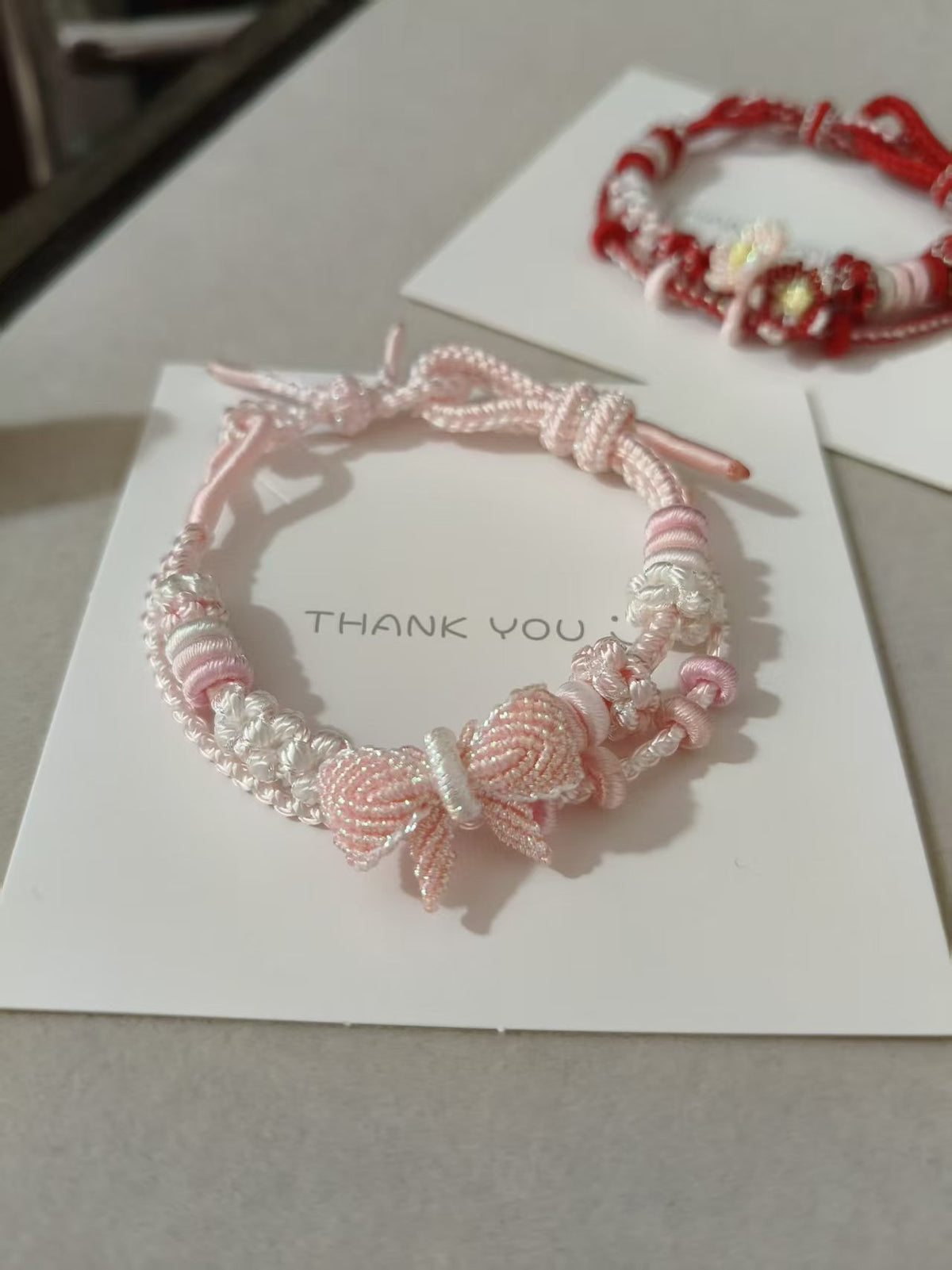Handwoven Pink White Gradient Bracelet with Bow