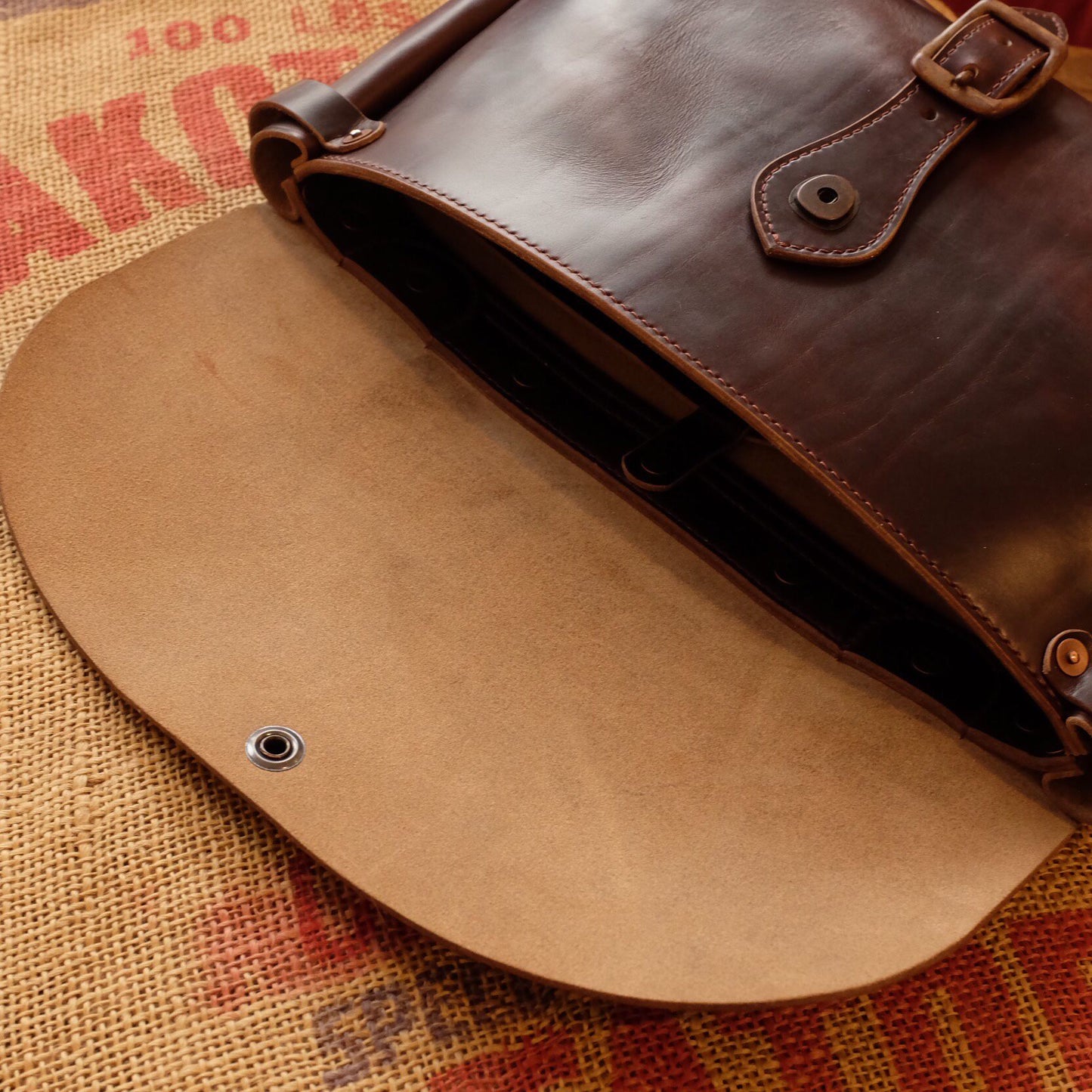 Rich Brown Leather Messenger Bag with Brass Buckle Closure