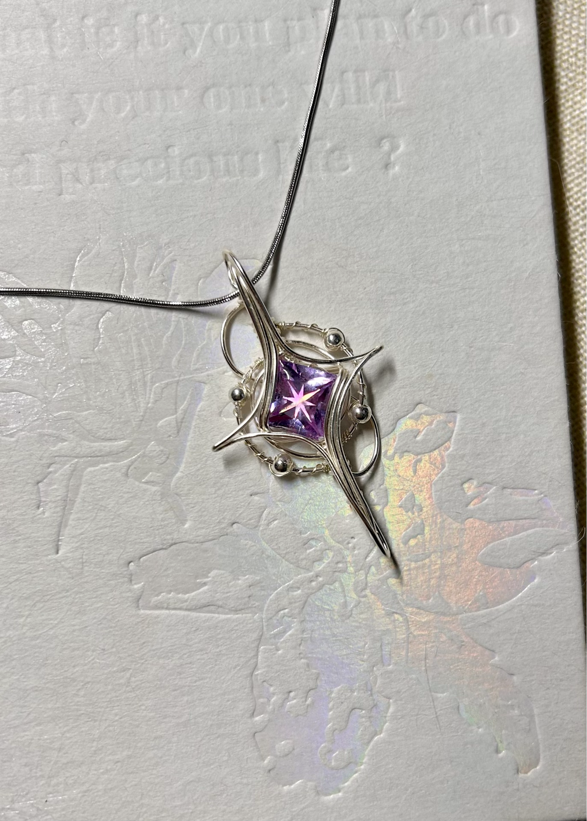 Wire Wrapped Purple Zircon Star Pendant