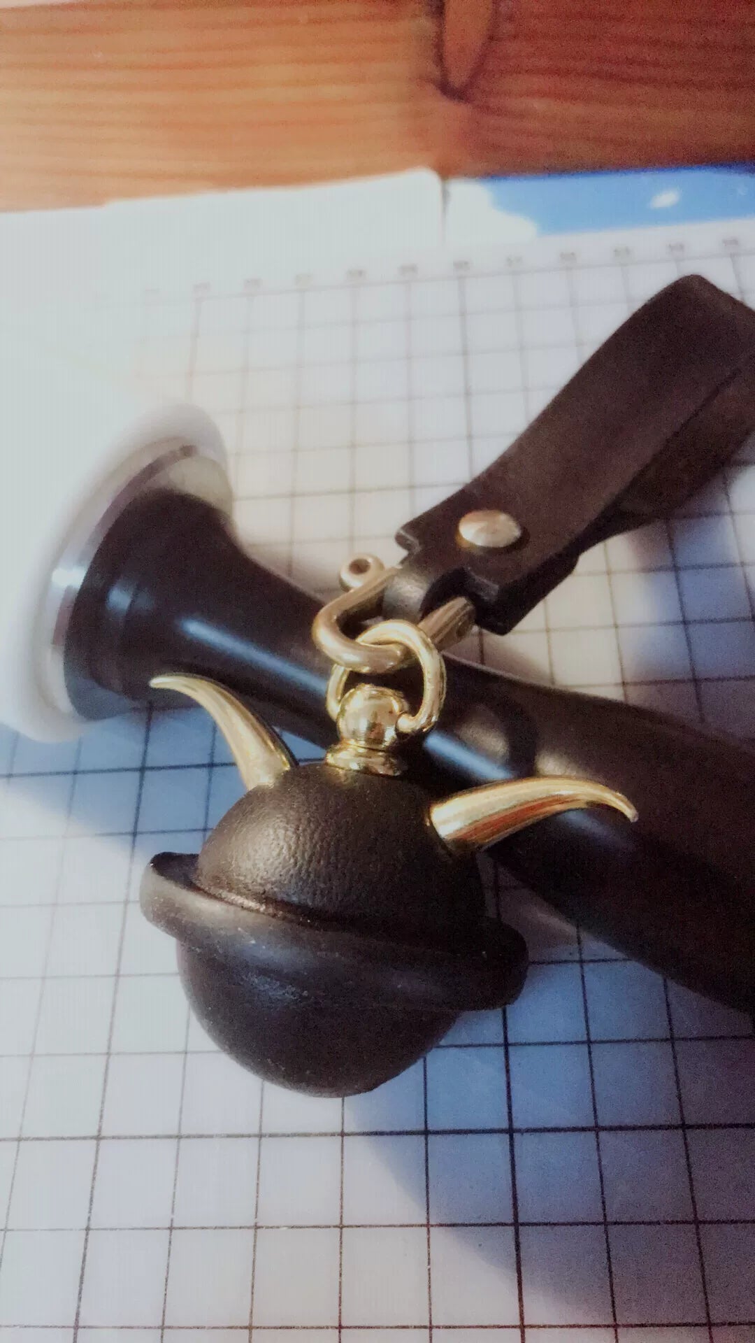Black Leather Bell Charm with Gold Horns