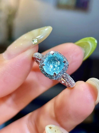18k Gold Ring with 1.1ct Neon Blue Cushion-Cut Gemstone and 0.41ct Diamond Halo