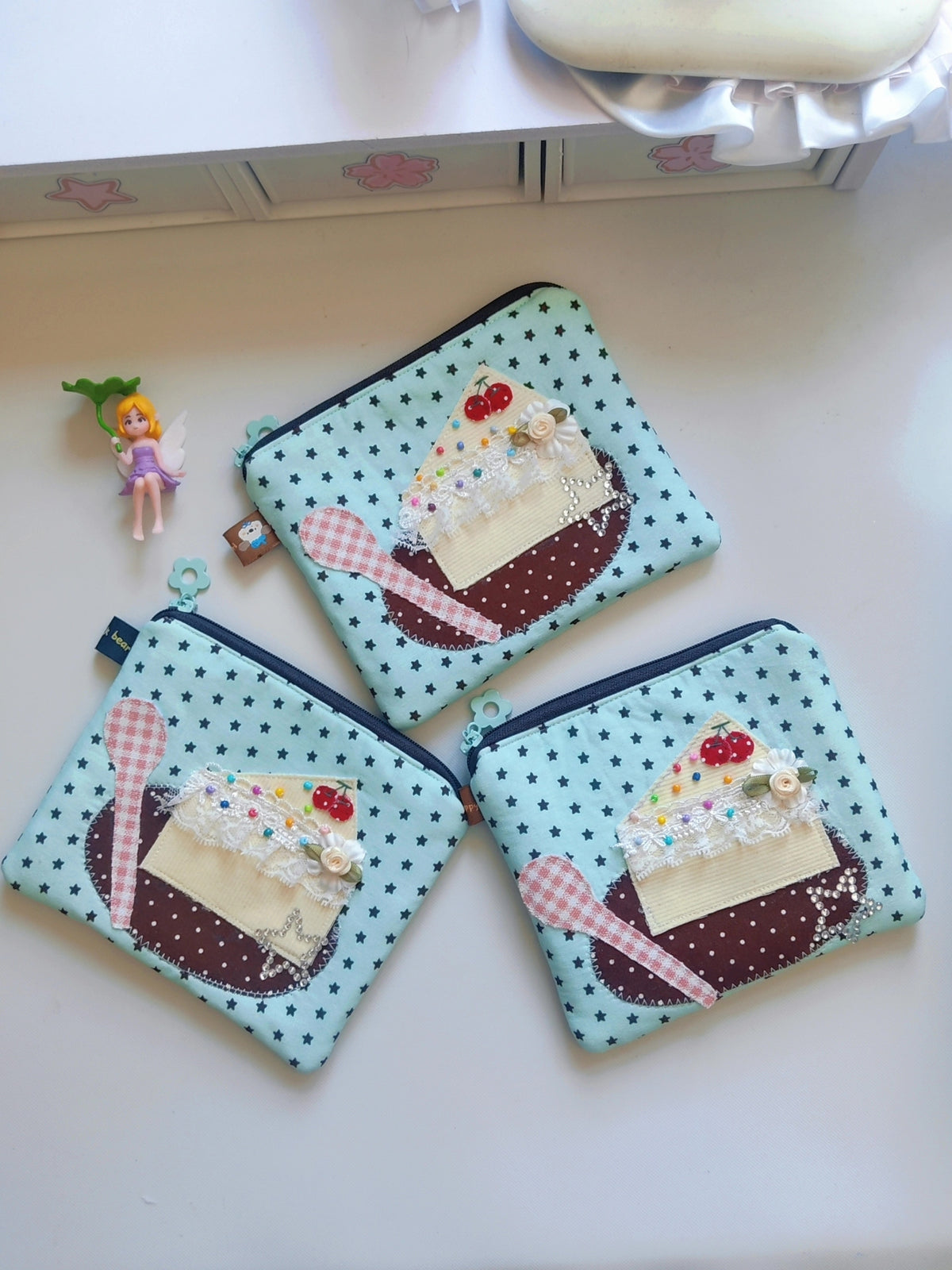 Monedero de tela con tarta y estrellas menta